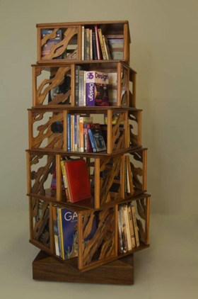 Revolving bookcase. The shelves rotate as one so the profile weaves